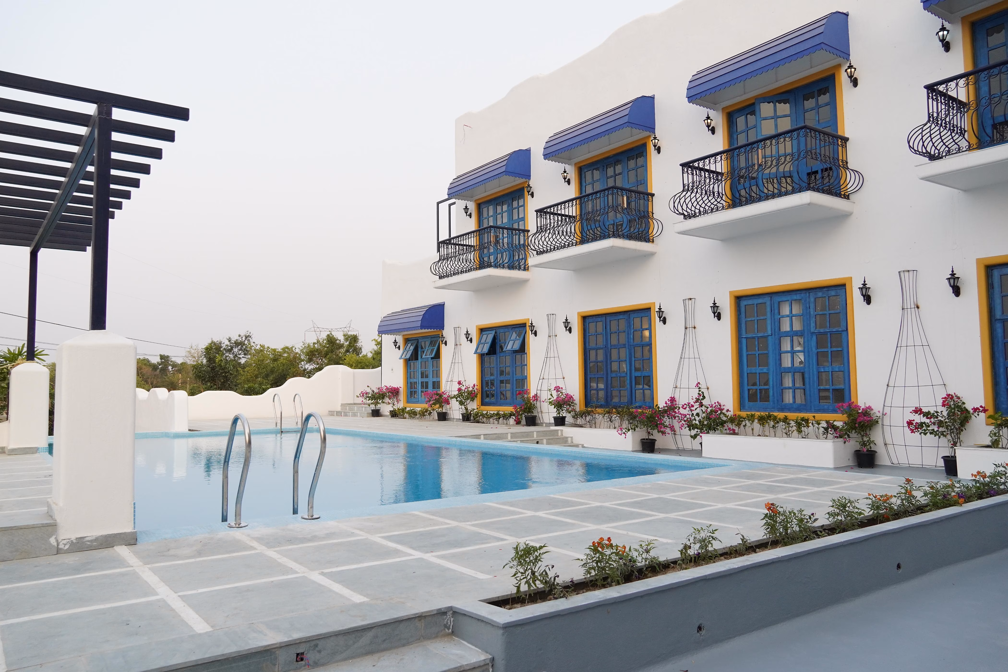 Blue-and-white facades at Ananda Resorts, Bolpur